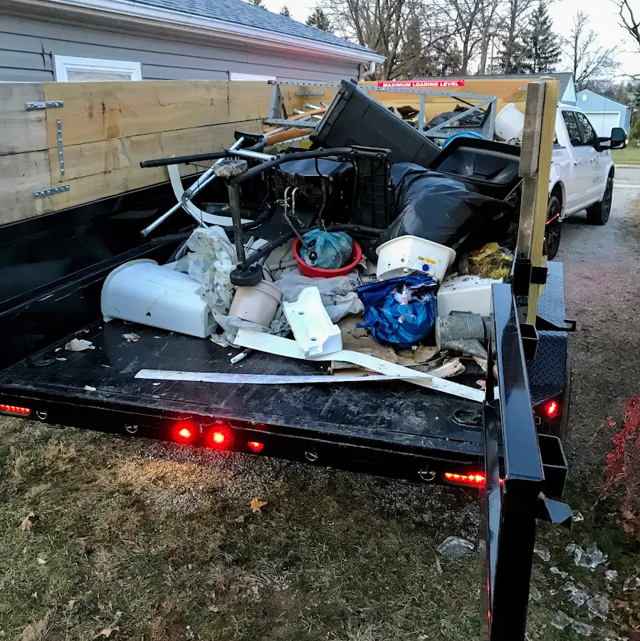 Roll-off dumpster delivered to a residential driveway in Summerfield