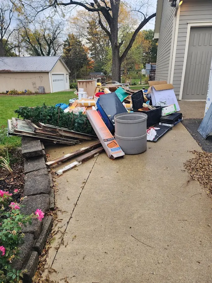 Dumpster being loaded with debris for 30 Yard Dumpster Rental in Summerfield